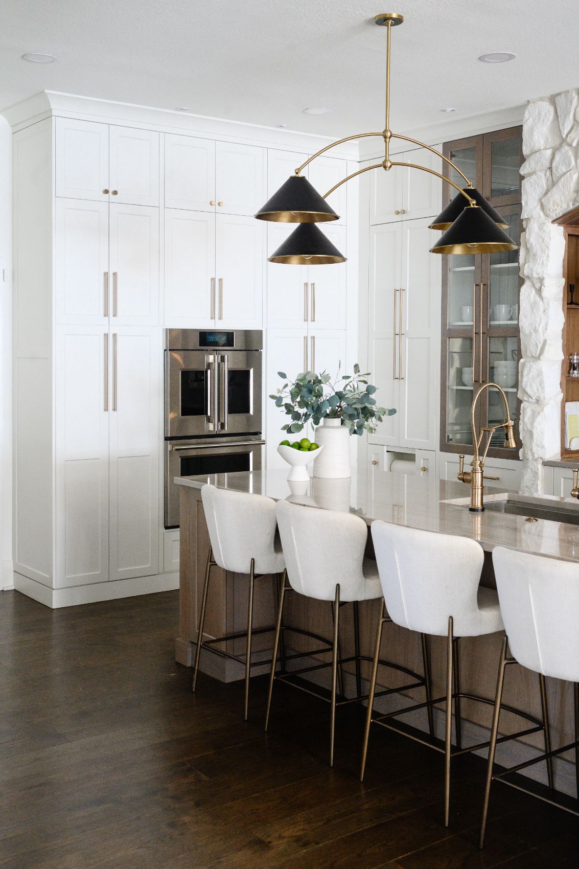 Mary Court kitchen island beneath a sculptural brass fixture